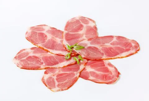 Delicious sliced cured ham shaped like flower Stock Photos