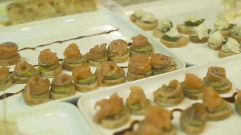 Delicious snacks and canape on table at event party. Close up appetizing snacks Stock Footage 95173908