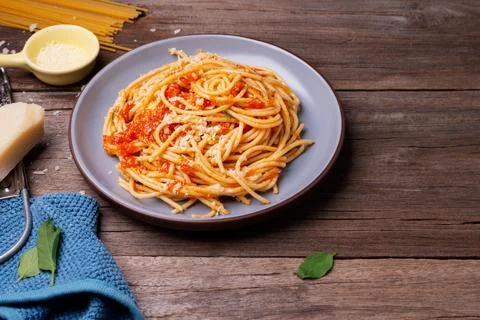 Delicious spaghetti cheese pasta served on a plate Vegetables, Italian toma.. Stock Photos