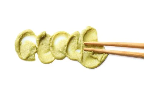 Delicious spicy wasabi and chopsticks on white background, top view. Traditio Stock Photos