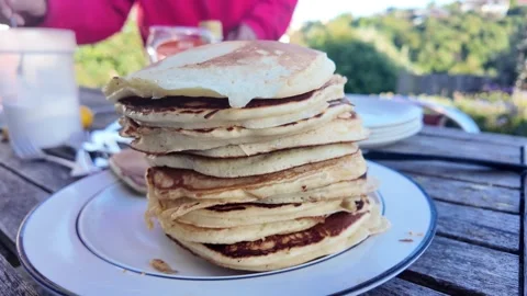 Delicious stack of pancakes for breakfast outdoors Stock Footage 329813739