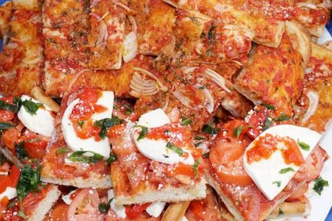 Delicious stack of pizza slices on a tray at a party Stock Photos