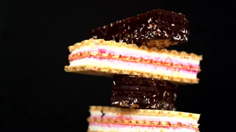 Delicious stack of wafer cookies and chocolate bars rotates. textures of Stock Footage 289039737