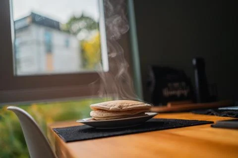 Delicious Steaming Stack of Delicious Homemade Pancakes Sitting on a Wooden.. Stock Photos