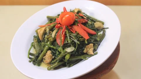 A delicious stir-fried kale dish is ready to be served Stock Footage 334268336