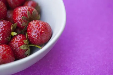 Delicious strawberries in a bowl Stock Photos