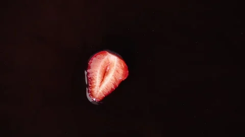 Delicious strawberry falling into chocolate, view from top, super-slow motion Stock Footage 279138265