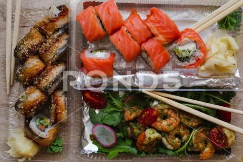 Delicious Sushi and Shrimps in Plastic to-go Boxes. Stock Photos