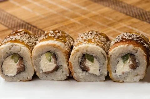 Delicious sushi rolls on the table Stock Photos