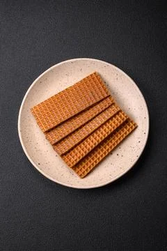 Delicious sweet crispy rectangular waffles on a ceramic plate 스톡 사진