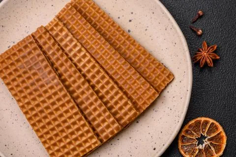 Delicious sweet crispy rectangular waffles on a ceramic plate 스톡 사진