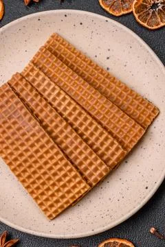 Delicious sweet crispy rectangular waffles on a ceramic plate Stockfoto's