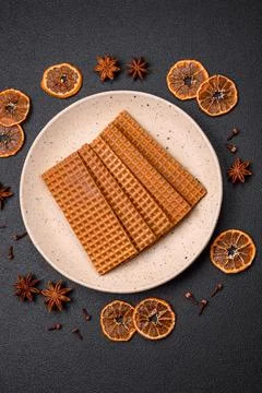Delicious sweet crispy rectangular waffles on a ceramic plate Stockfoto's