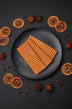 Delicious sweet crispy rectangular waffles on a ceramic plate Stock Photos