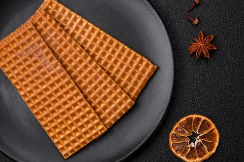 Delicious sweet crispy rectangular waffles on a ceramic plate Stock Photos