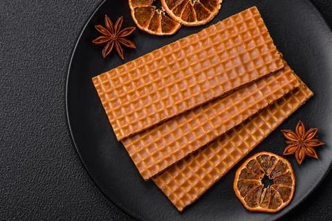 Delicious sweet crispy rectangular waffles on a ceramic plate Stockfoto's