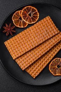 Delicious sweet crispy rectangular waffles on a ceramic plate Stock Photos