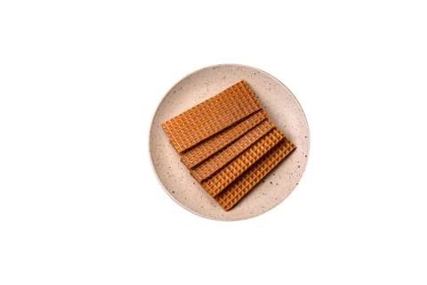 Delicious sweet crispy rectangular waffles on a ceramic plate 스톡 사진