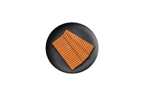 Delicious sweet crispy rectangular waffles on a ceramic plate 스톡 사진