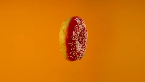 Delicious sweet donut rotating Stock Footage 125010967