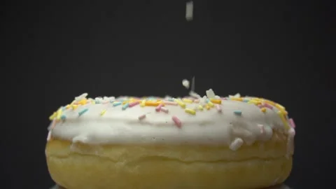 Delicious sweet donut rotating on a plate. Side view. Bright and colorful Stock Footage 85874331