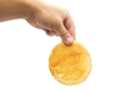 Delicious sweet pancake in hand Stock Photos