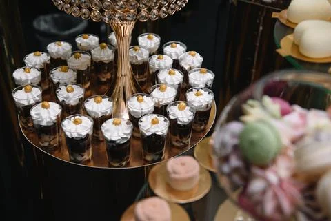 Delicious sweets on candy buffet. Table with sweets, buffet with cupcakes, Ma Stock Photos