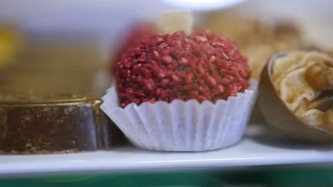 Delicious sweets of different tastes and forms lie on the display case. HD Stock Footage 85773846