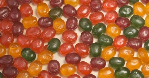 Delicious sweets lies on table, camera rotates around, junk food, a lot of sugar Stock Footage 119074207