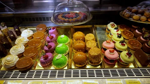 Delicious sweets on the shop window in the cafe Stock Footage 255452057