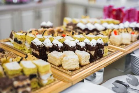 Delicious sweets on wedding candy buffet with desserts, cupcakes Stock Photos