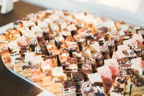 Delicious sweets on wedding candy buffet with desserts, cupcakes Stock Photos