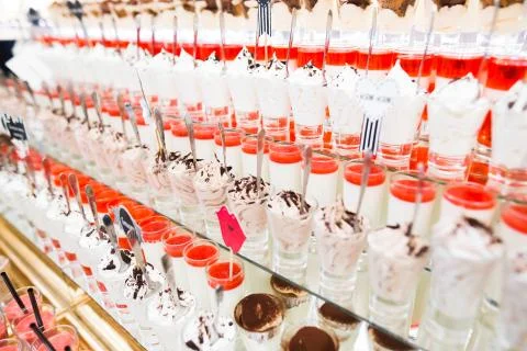 Delicious sweets on wedding candy buffet with desserts, cupcakes Stock Photos