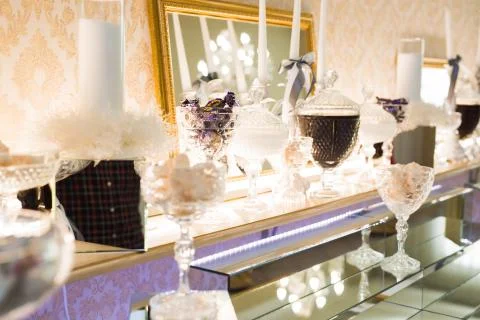 Delicious sweets on wedding candy buffet with desserts, cupcakes Stock Photos