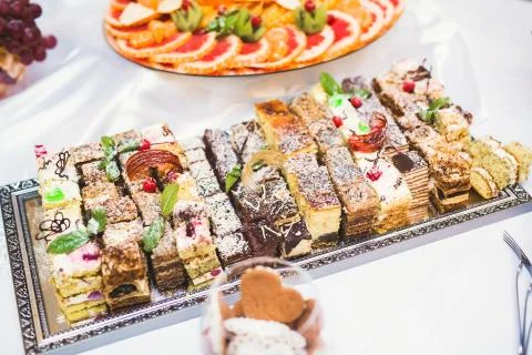 Delicious sweets on wedding candy buffet with desserts, cupcakes Stock Photos