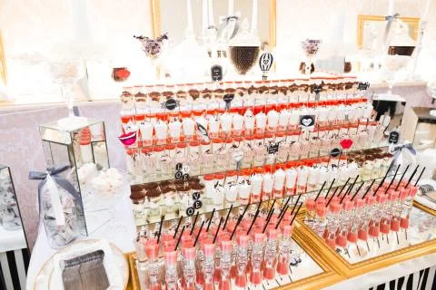 Delicious sweets on wedding candy buffet with desserts, cupcakes Stock Photos
