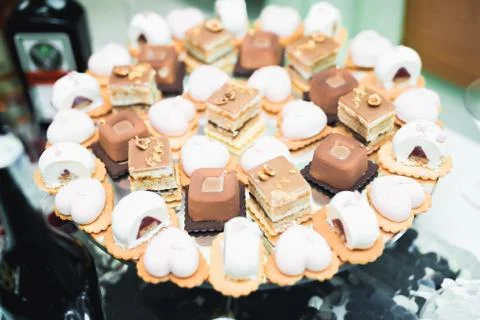 Delicious sweets on wedding candy buffet with desserts, cupcakes Stock Photos