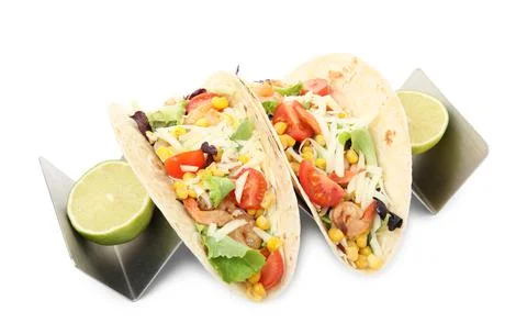 Delicious tacos with shrimps, cheese and lime on white background Stock Photos