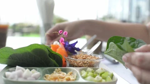 Delicious Thai snack, a royal leaf wrap appetizer Stock Footage 159421961
