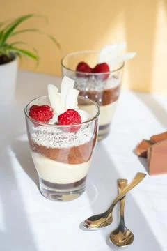 Delicious three-layer mousse, vanilla, chocolate, creme brulee dessert in a Stock Photos
