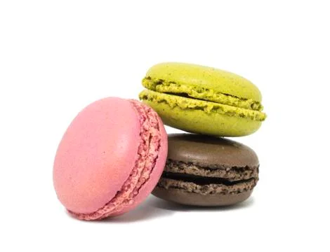 Delicious three multicolored macaroon on a white background Stock Photos
