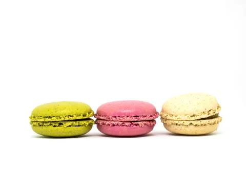 Delicious three multicolored macaroon on a white background Stock Photos