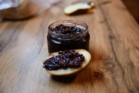 Delicious toasted bread with strawberry jam oozing out, served on a white p.. 写真素材