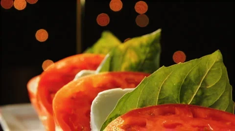 Delicious tomatoes, olive oil, and cheese Stock Footage