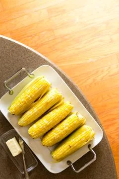 Delicious tray of cooked corncobs Stock Photos