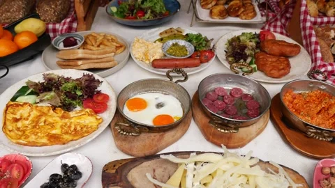 Delicious turkish breakfast spread in a cozy setting with friends Stock Footage 338377691