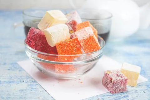 Delicious turkish delights with black tea Stock Photos