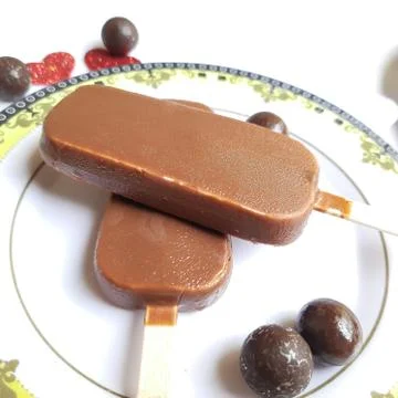 Delicious two chocolate icecream bar with chocolate ball in white plate plate Stock Photos