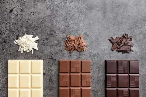Delicious variety of chocole on rustic background Stock Photos