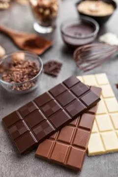 Delicious variety of chocole on rustic background Stock Photos